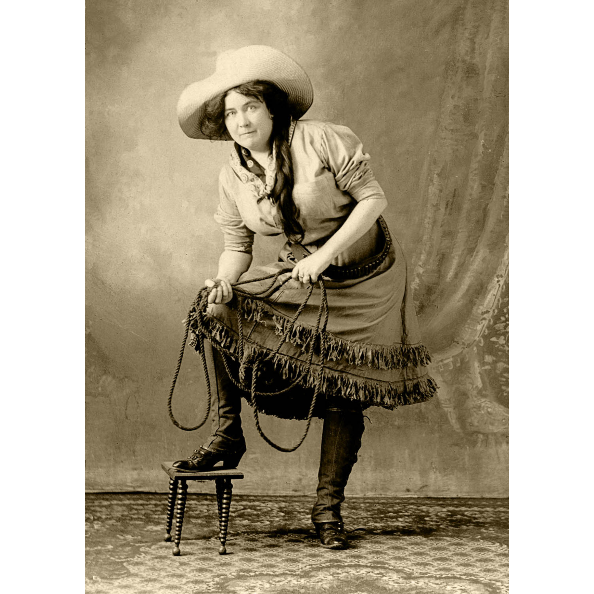 Cowgirl foot on Stool Holding Rope - ca. 1915 Photograph